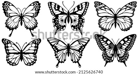 Drawing black silhouettes of butterflies on a white background Royalty-Free Stock Photo #2125626740