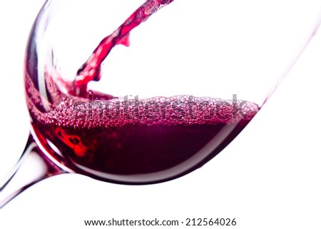  Red wine in wineglass on white background Royalty-Free Stock Photo #212564026