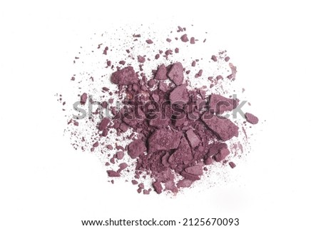 Smashed dark slightly purplish red makeup sample isolated on white background	