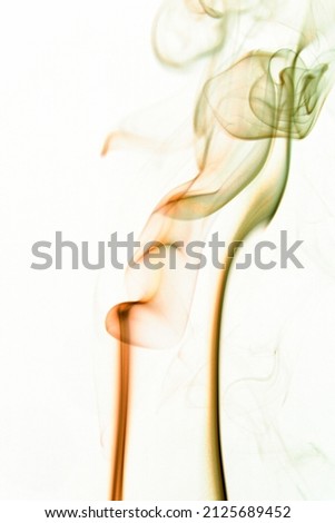 Photo of real colorful smoke on white background. Graphic resource for use with blend modes. Fusion layers.