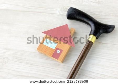 House object and stick for seniors Royalty-Free Stock Photo #2125698608