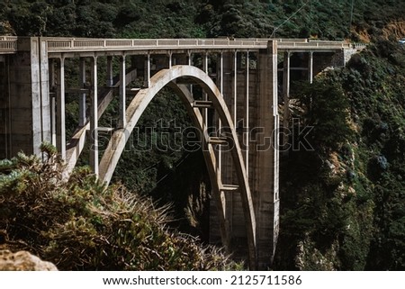 Bixby Bridge in Big Sur around its greenery Royalty-Free Stock Photo #2125711586