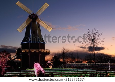 Illuminated windmill with a rotating night view