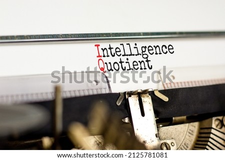 IQ intelligence quotient symbol. Concept words IQ intelligence quotient on white paper typed on retro typewriter. Beautiful white background. Business IQ intelligence quotient concept, copy space.