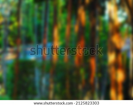 brown vines with blurred green leaves serve as a background