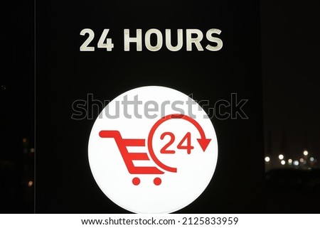 24 hours glowing sign. night signboard twenty four hours market shop