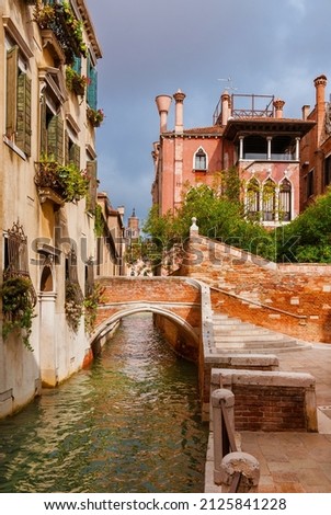 View of Rio delle Toreseie, a characteristic Venice canal with old traditional and colorful houses in the quiet Dorsoduro District Royalty-Free Stock Photo #2125841228