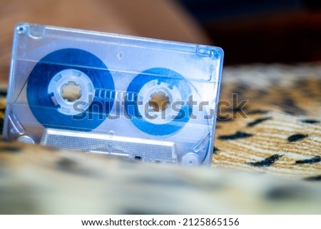 Audio cassette close-up on a colored blurry background.Background photo.To the desktop of the computer .Nostalgia for the nineties .
