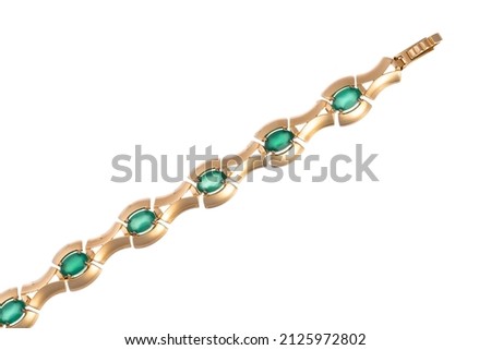 golden bracelet with green stones chrysolite on a white isolated background
