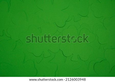 An abstract photograph of four leaf clovers or shamrocks make a colorful green background or wallpaper, great for St. Patrick's Day.