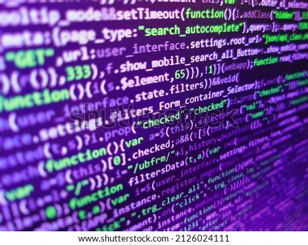 SEO optimization. HTML5 concept macro backdrop in warm colors. Computer code on laptop (web developing). Digital abstract bits data stream, cyber pattern digital background. Programmer occupation