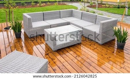 Patio furnitures outside in a rainy day.