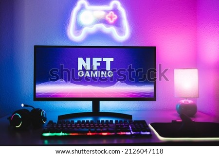Metaverse and Blockchain Technology Concept - Gaming room displaying NFT marketplace on computer screen - Focus on monitor Royalty-Free Stock Photo #2126047118