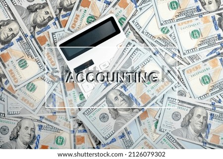 Accounting word on photo with finance, money, calculator.