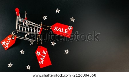Banner, poster.Black Friday sale concept. Flat lay, top view, overhead.Black Friday shopping sale concept with red ticket Sale tag close up on black background.copy space. black friday concept.