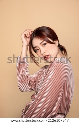 A beautiful Asian female face Royalty-Free Stock Photo #2126107547