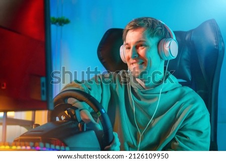 professional gamer playing car simulator