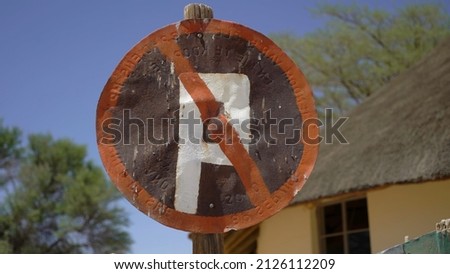 No Parking. Old rusty iron road sign. Abandoned road in the desert in Africa. City Solitaire, Namibia.