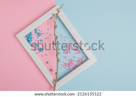 willow and colored easter powder in a white frame