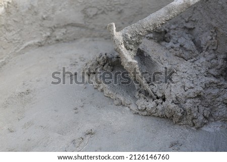 Mixing concrete is the mixing of concrete mixtures such as cement, stone or gravel, sand, water and other admixtures (such as concrete admixtures). Royalty-Free Stock Photo #2126146760