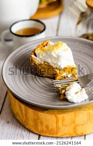 Lemon tart with merengue. Lemon pie on shortbread dough.