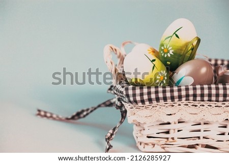 painted easter eggs in a basket