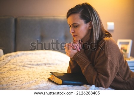 Woman with pray and worship god in her bedroom Royalty-Free Stock Photo #2126288405