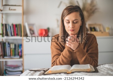 Woman with pray and worship god in her bedroom Royalty-Free Stock Photo #2126294342