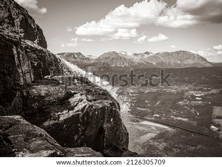 Old black and white picture of the amazing panorama view from top of the Hydnefossen waterfall and Veslehødn Veslehorn mountain in Hemsedal Norway.