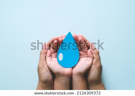 Hands holding clean water drop,world water day,hand sanitizer and hygiene, vaccine for covid-19 pandemic, family washing hands, CSR, save water, clean renewable energy, flood disaster relief concept Royalty-Free Stock Photo #2126309372