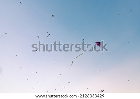 Many different kites are flying in the sky Royalty-Free Stock Photo #2126333429