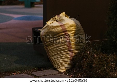 garbage bag silhouette at night