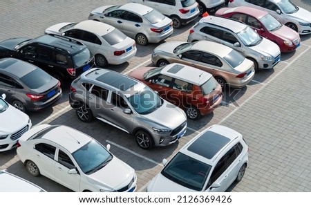 Lots of cars parking at outside carpark Royalty-Free Stock Photo #2126369426