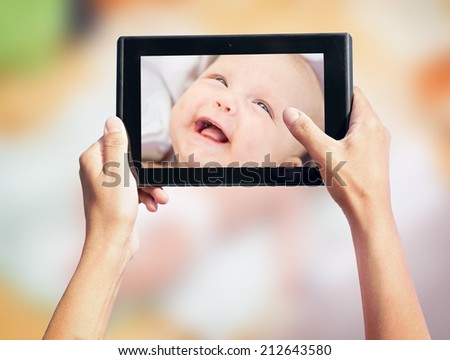 photo shooting on tablet pc a newborn baby