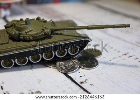 toy tank on a bunch of russian roubles close up crisis wallpaper