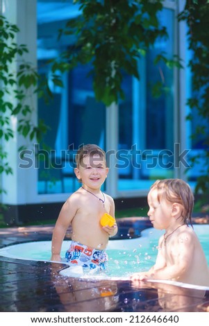 kids playing in the paddling pool