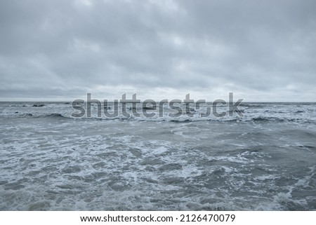 Baltic sea after the storm. Dramatic glowing clouds. Seascape, cloudscape, gale, nature. Panoramic view. Ecology, climate change, weather Royalty-Free Stock Photo #2126470079