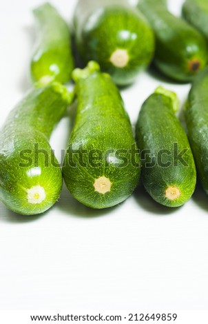 zucchini on white wooden table, not isolated