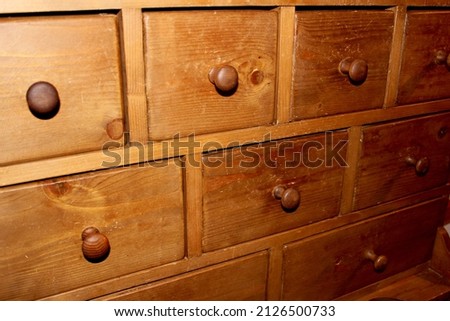 Antique wardrobe with wooden drawers