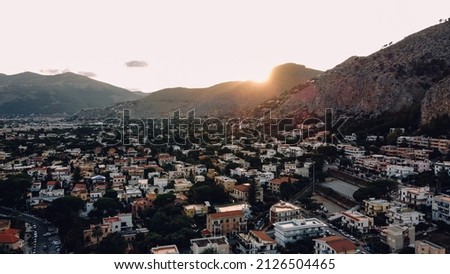 Panoramic landscape of Mondello Beach at sunset, Palermo, Sicily. Aerial view of Mediterranean coastal town at sunset.
