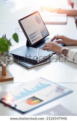 Business people team working at office with tablet and document, doing planning analyzing the financial report, business plan investment, finance analysis concept. Economic business discussions. Royalty-Free Stock Photo #2126547446