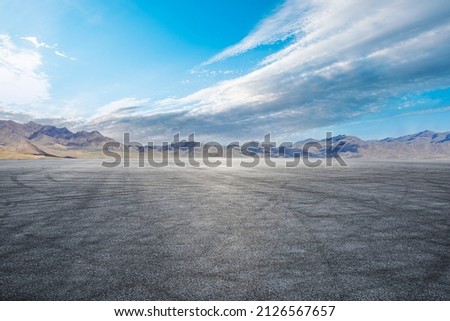Empty asphalt road and mountain nature scenery under blue sky Royalty-Free Stock Photo #2126567657