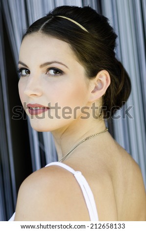 beautiful girl with make-up, hairstyling and antic visage