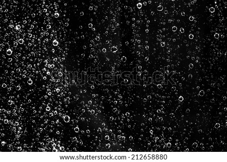 waterdrops bubbles on a dark background Royalty-Free Stock Photo #212658880