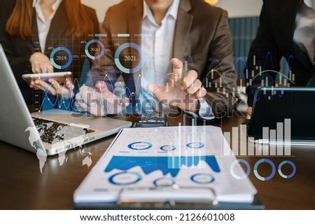 Investor analyzing stock market report and financial dashboard with business intelligence , with key performance indicatorsBusiness team meeting. Photo professional investor working new  project 
