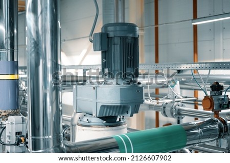 Powerful electric motors of vibrating mills in workshop Royalty-Free Stock Photo #2126607902