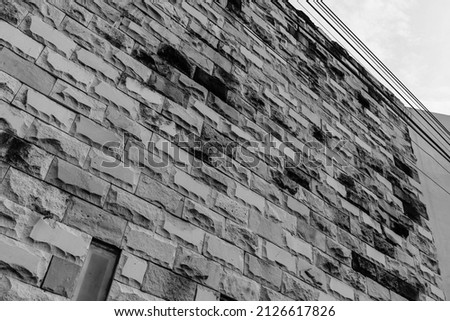 Old grunge dirty brick wall surface. Abstract tiled brick work background and pattern.