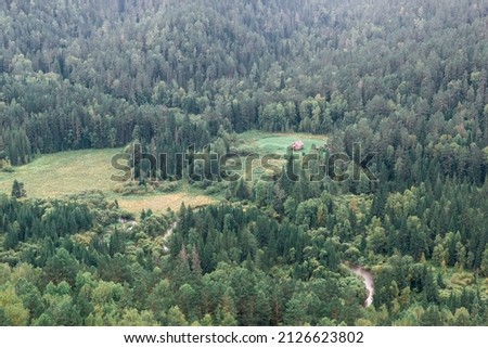 Forester's house in the river valley Royalty-Free Stock Photo #2126623802