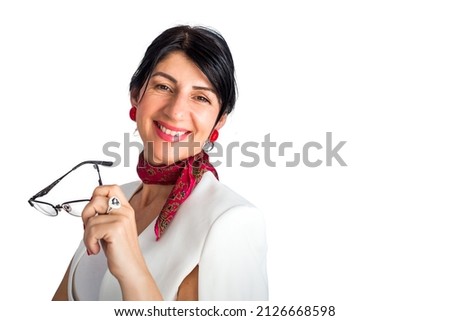 Portrait of elegant brunette woman holding eyeglasses and smiling. Isolated on white background
