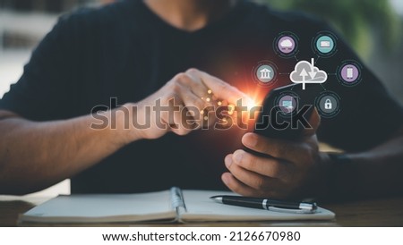 Cloud computing and technology icons touched by hand. Cloud technology collects lifestyle and confidential information such as shopping and internet banking, passwords, financial information.